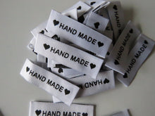 Load image into Gallery viewer, 10 White Labels printed with &quot;Hand Made&quot; between Black Hearts Labels 50 x 15mm