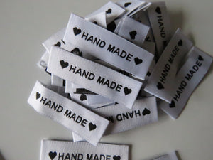 25 White Labels printed with "Hand Made" between Black Hearts Labels 50 x 15mm