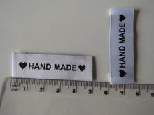 Load image into Gallery viewer, 50 White Labels printed with &quot;Hand Made&quot; between Black Hearts Labels 50 x 15mm