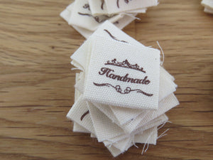 50 Hand made between tiara  and  fancy scroll cotton flag labels. 2 x 2cm