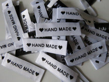 Load image into Gallery viewer, 50 White Labels printed with &quot;Hand Made&quot; between Black Hearts Labels 50 x 15mm