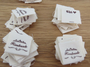 50 Hand made between tiara  and  fancy scroll cotton flag labels. 2 x 2cm