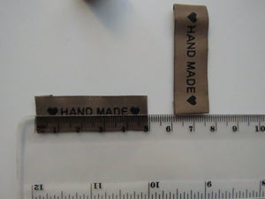 25 Tan Brown "Hand Made" between 2 Brown Hearts Labels 50mm x 15mm