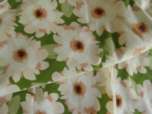 1.7m White Flower print on green organic cotton spandex jersey knit 150cm- last piece left