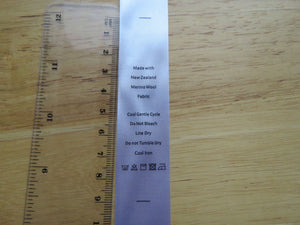 10 White Satin washing instructions/ Made with New Zealand Merino wool labels