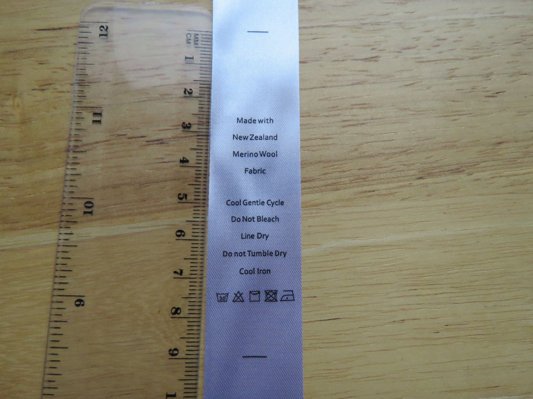 10 White Satin washing instructions/ Made with New Zealand Merino wool labels