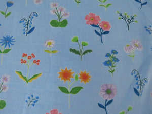 1m Flower Print Floral on blue background organic cotton spandex jersey knit 155cm