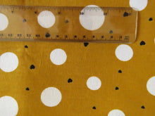 Load image into Gallery viewer, 1m Mustard with white spots and mini black hearts  100% organic cotton jersey knit 112cm