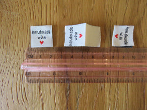 10 White Handmade with red heart 2 x 2cm satin labels.