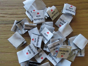 10 White Handmade with red heart 2 x 2cm satin labels.