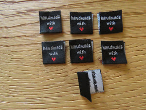 10 Black Handmade with red heart 2 x 2cm satin flag labels.