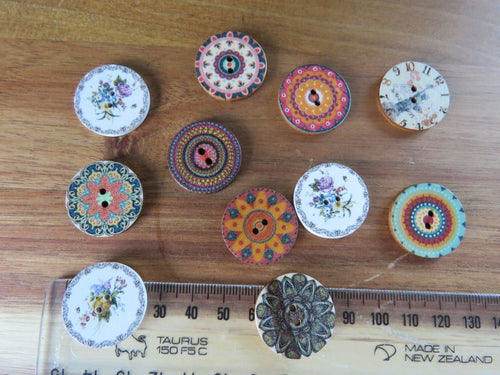 11 Mixed St of 25mm buttons as shown in photos -set of 11