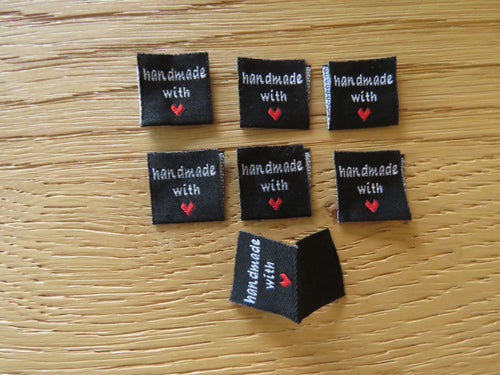 50 Black Handmade with red heart 2 x 2cm satin flag labels.